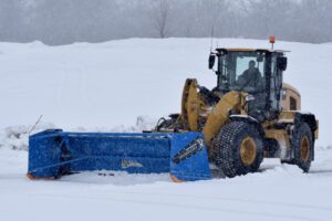 Kage SnowDozer Snow Plow on CAT Front End Loader