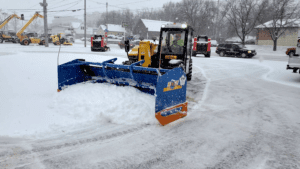 Gehl telehandler plowing snow with KAGE SnowFire